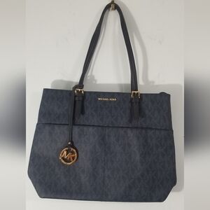 Michael Kors Leather Monogrammed Purse. 4 Exterior Slip Pockets. Clean Interior.